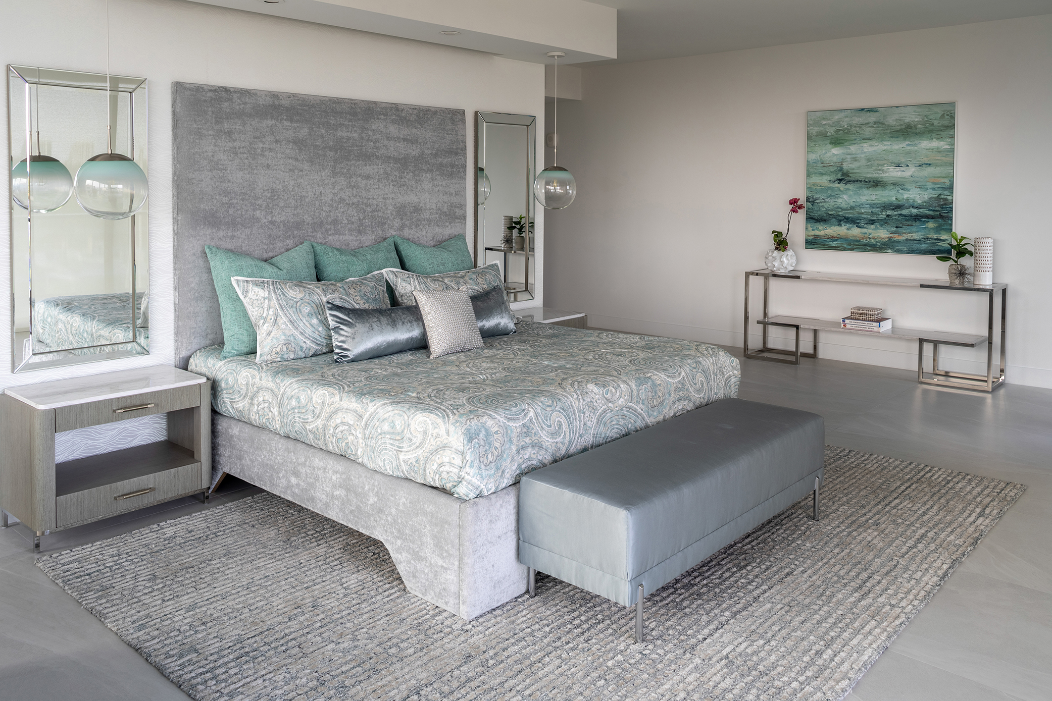 Decorating Den Interiors bedroom with sea foam green accents and a grey bed bench.